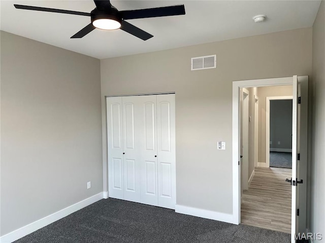 208 Pacific Ave, Union, MO 63084 - unfurnished bedroom featuring baseboards, a closet, dark carpet, and a ceiling fan