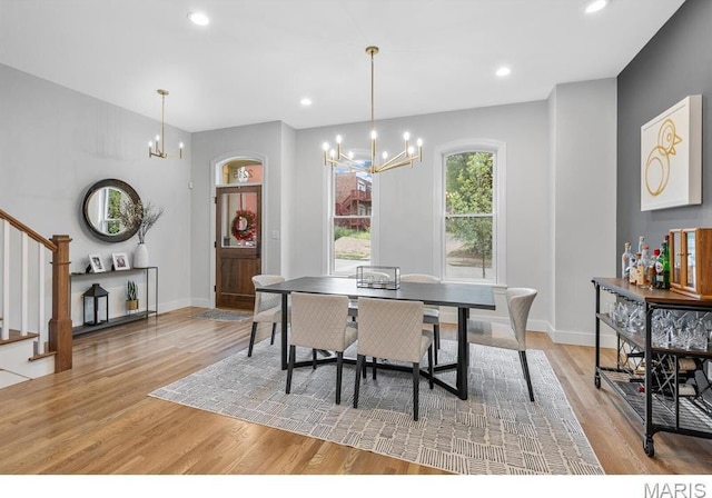 2211 Hickory, Saint Louis, MO 63104 - dining room featuring a chandelier, light wood-type flooring, stairs, baseboards, and recessed lighting
