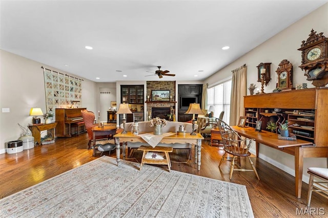 9906 Sappington Rd, Saint Louis, MO 63128 - living room featuring a ceiling fan, a large fireplace, wood finished floors, recessed lighting, and baseboards