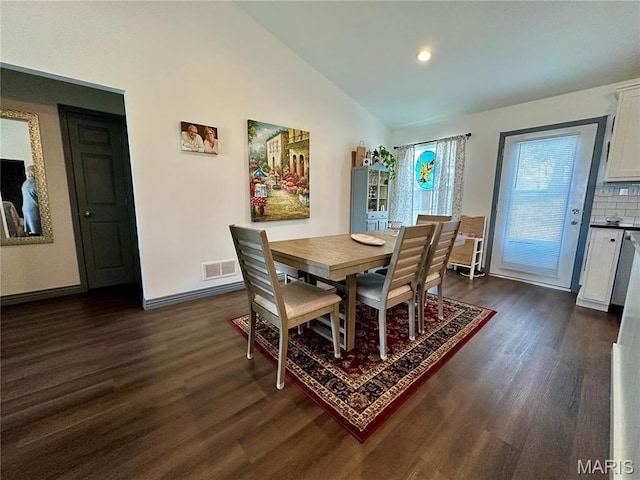 dining space featuring dark wood-style floors, vaulted ceiling, baseboards, and recessed lighting