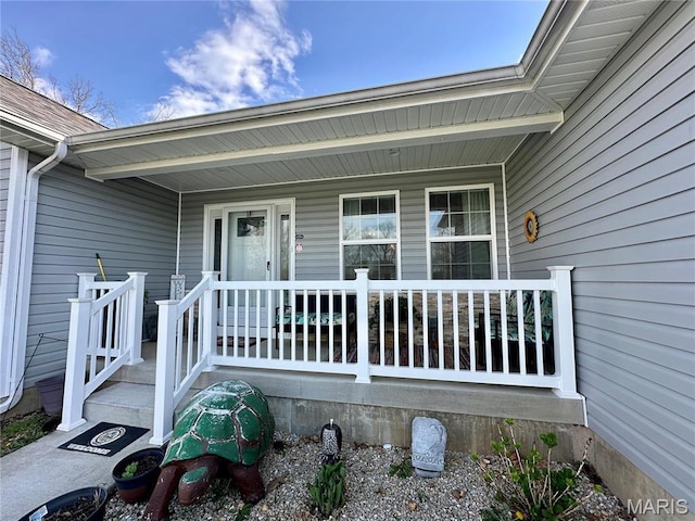 view of exterior entry featuring a porch