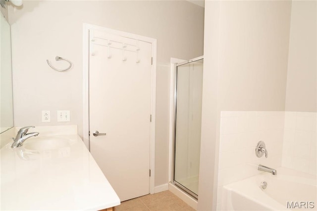 1520 Washington Ave Unit 604, Saint Louis, MO 63103 - full bathroom with a shower stall, tile patterned floors, a bath, and vanity