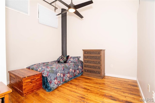 1520 Washington Ave Unit 604, Saint Louis, MO 63103 - bedroom featuring wood-type flooring, a ceiling fan, and baseboards