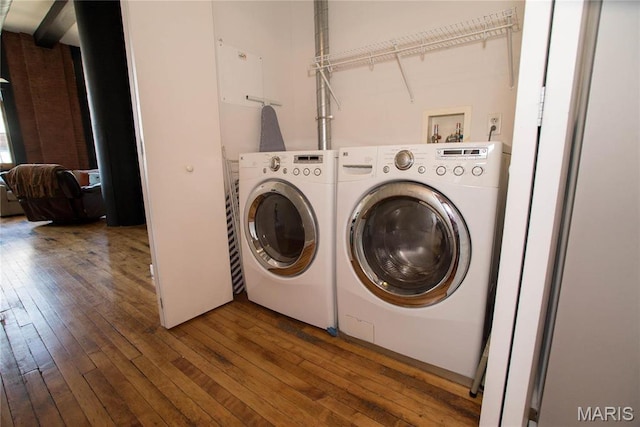 1520 Washington Ave Unit 604, Saint Louis, MO 63103 - washroom featuring washer and dryer and hardwood / wood-style floors