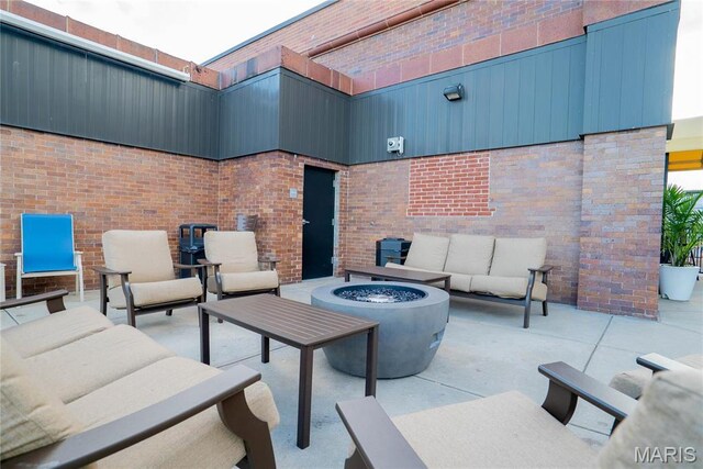 1520 Washington Ave Unit 604, Saint Louis, MO 63103 - view of patio with an outdoor living space with a fire pit