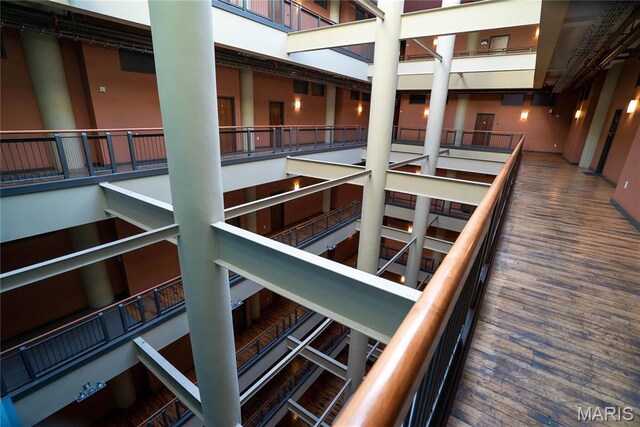 1520 Washington Ave Unit 604, Saint Louis, MO 63103 - staircase with wood finished floors and a towering ceiling