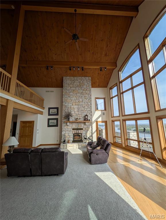 1 River Ridge Rd, Grafton, IL 62037 - living room featuring high vaulted ceiling, beam ceiling, wooden ceiling, ceiling fan, and a stone fireplace