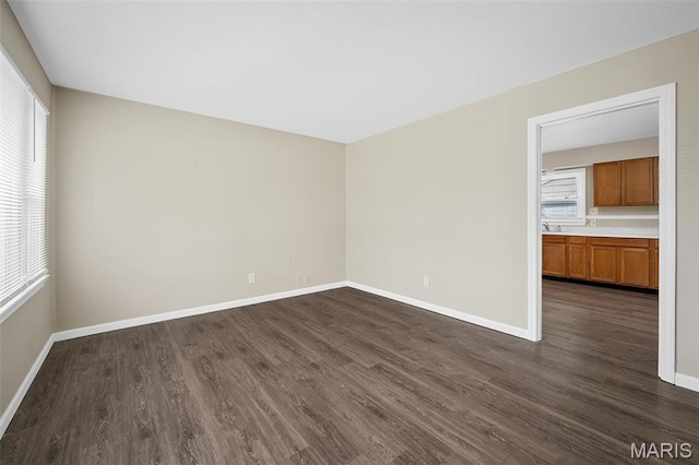 11225 Saint Shawn Ln, Saint Ann, MO 63074 - empty room with dark wood-type flooring and baseboards
