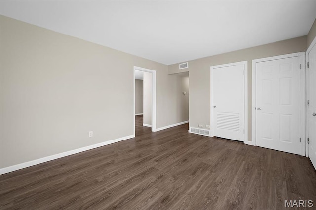 11225 Saint Shawn Ln, Saint Ann, MO 63074 - unfurnished bedroom with dark wood finished floors and baseboards