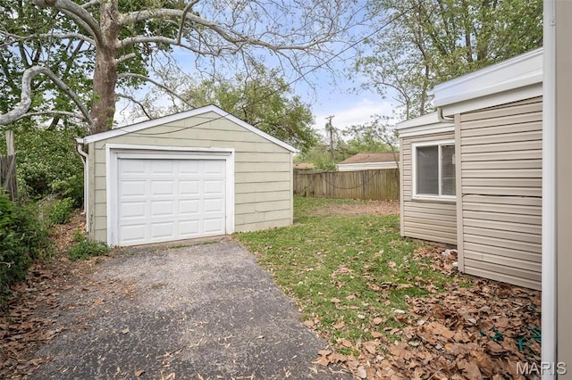 11225 Saint Shawn Ln, Saint Ann, MO 63074 - detached garage with fence and asphalt driveway