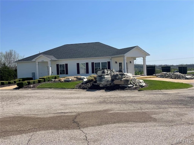 view of front of home with fence