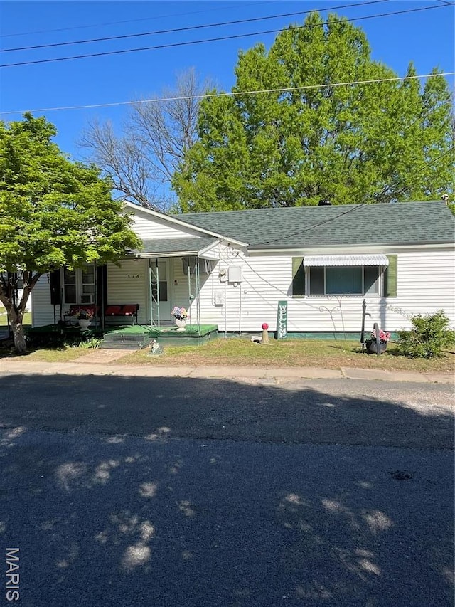 316 Bellvue St, Steele, MO 63877 - view of front of house with a shingled roof and covered porch