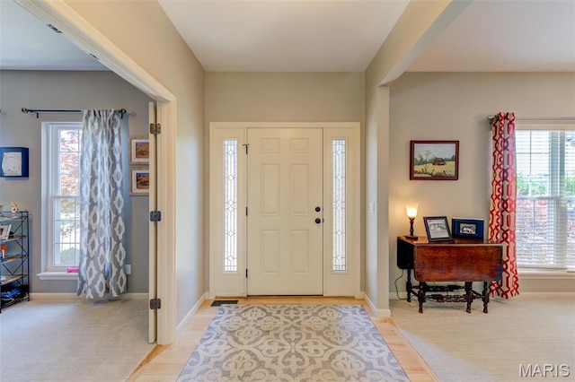 1024 Brook Mont Dr, Ofallon, MO 63366 - foyer featuring healthy amount of natural light, baseboards, and light wood-type flooring