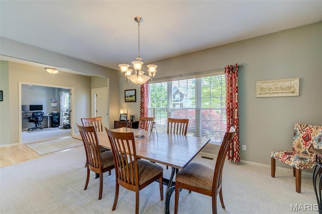 1024 Brook Mont Dr, Ofallon, MO 63366 - dining space with a chandelier, a desk, and baseboards