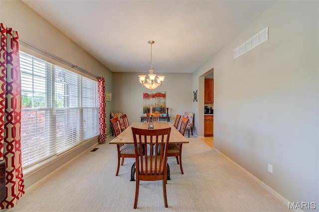 1024 Brook Mont Dr, Ofallon, MO 63366 - dining space featuring a chandelier and light carpet