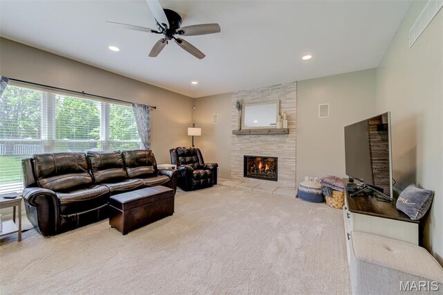 1024 Brook Mont Dr, Ofallon, MO 63366 - carpeted living room featuring a ceiling fan, a tiled fireplace, and recessed lighting