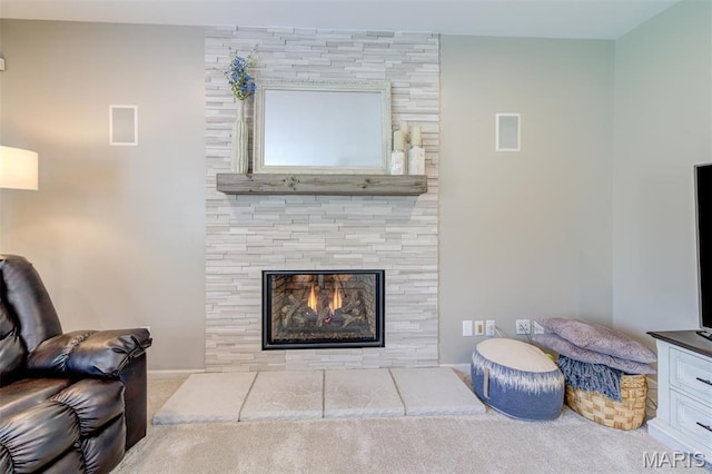 1024 Brook Mont Dr, Ofallon, MO 63366 - carpeted living area with a fireplace and baseboards