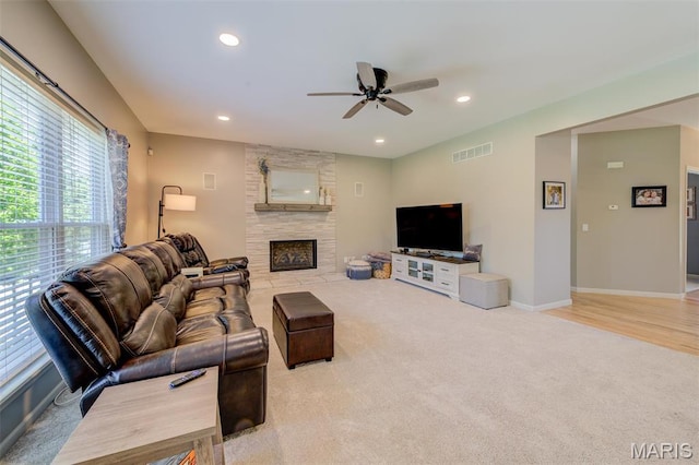 1024 Brook Mont Dr, Ofallon, MO 63366 - living area with healthy amount of natural light, carpet floors, ceiling fan, a stone fireplace, and recessed lighting