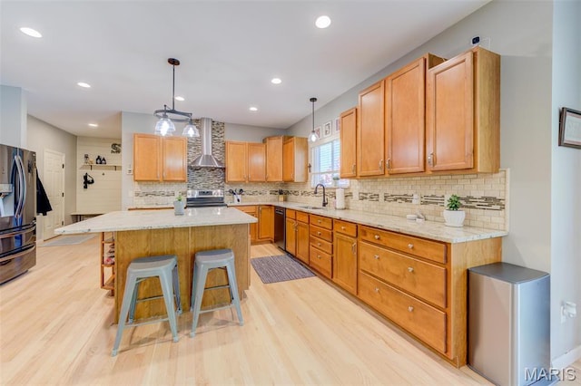 1024 Brook Mont Dr, Ofallon, MO 63366 - kitchen with stainless steel range with electric stovetop, a sink, fridge with ice dispenser, dishwasher, and wall chimney range hood