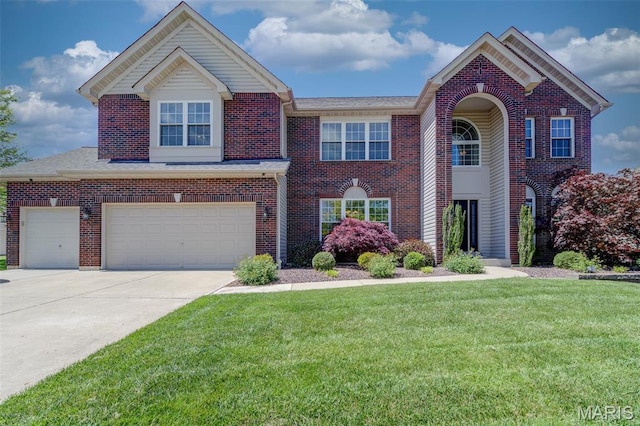 1024 Brook Mont Dr, Ofallon, MO 63366 - traditional home with brick siding, a front lawn, driveway, and a garage