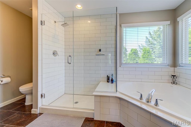 1024 Brook Mont Dr, Ofallon, MO 63366 - full bath featuring baseboards, a garden tub, a shower stall, and toilet