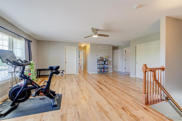 1024 Brook Mont Dr, Ofallon, MO 63366 - exercise area featuring light wood-type flooring, baseboards, and ceiling fan