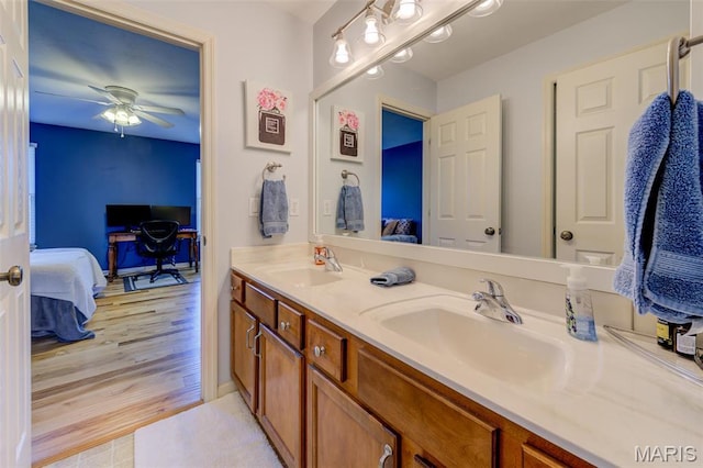 1024 Brook Mont Dr, Ofallon, MO 63366 - bathroom with connected bathroom, double vanity, ceiling fan, and baseboards