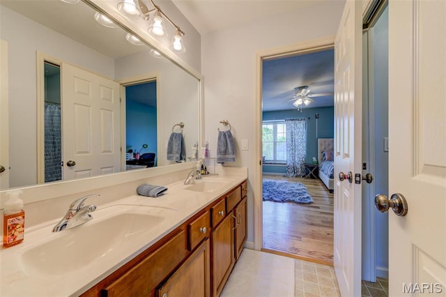 1024 Brook Mont Dr, Ofallon, MO 63366 - ensuite bathroom with double vanity and a ceiling fan