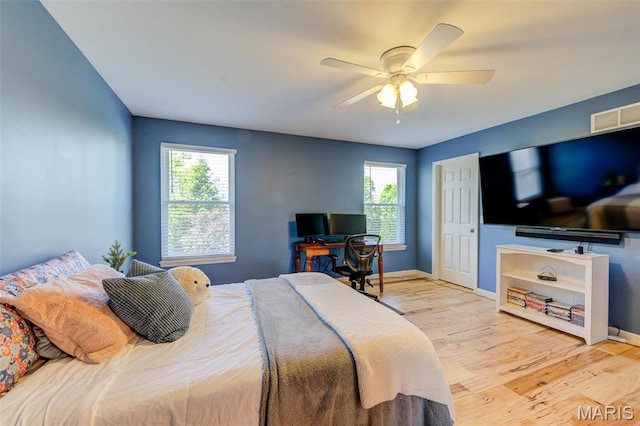 1024 Brook Mont Dr, Ofallon, MO 63366 - bedroom with light wood-style flooring, baseboards, and ceiling fan