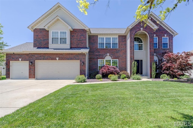 1024 Brook Mont Dr, Ofallon, MO 63366 - view of front of property with brick siding, concrete driveway, a front lawn, and a garage