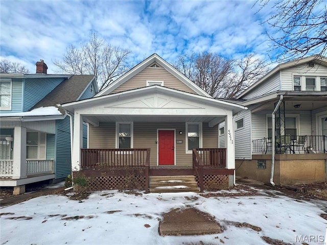 5511 S 37th St, Saint Louis, MO 63116 - view of front of property with covered porch and a chimney