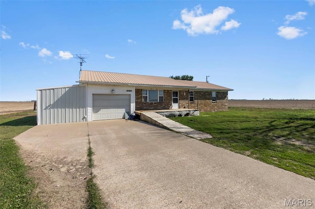 2112 County Highway 264, Gideon, MO 63848 - ranch-style home featuring an attached garage, driveway, metal roof, and a front lawn