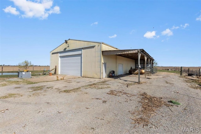 2112 County Highway 264, Gideon, MO 63848 - view of outbuilding with an outdoor structure and dirt driveway