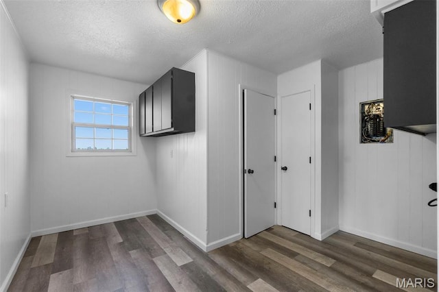 2112 County Highway 264, Gideon, MO 63848 - bonus room with a textured ceiling, wood finished floors, and baseboards