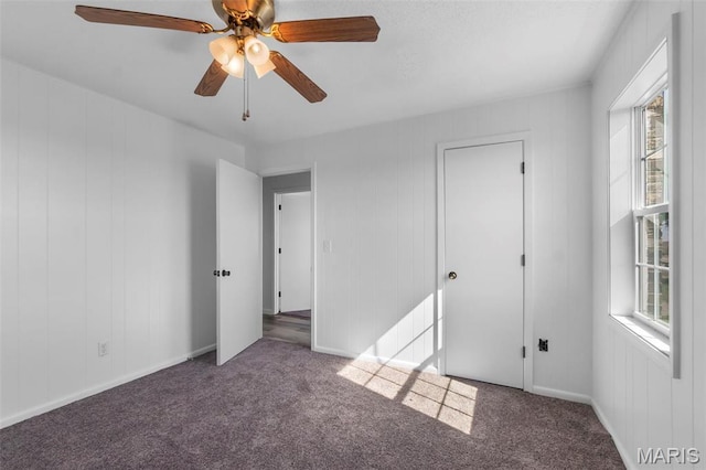 2112 County Highway 264, Gideon, MO 63848 - unfurnished bedroom with multiple windows, carpet floors, and ceiling fan