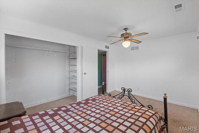 unfurnished bedroom with light carpet, ornamental molding, baseboards, and a ceiling fan