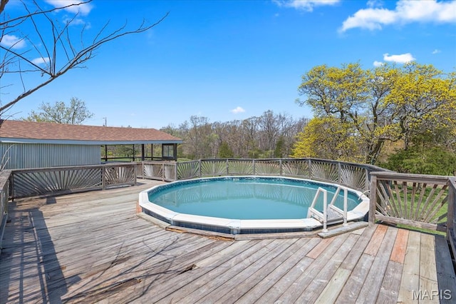 view of pool with a deck