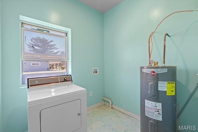 clothes washing area with washer / clothes dryer, water heater, and baseboards