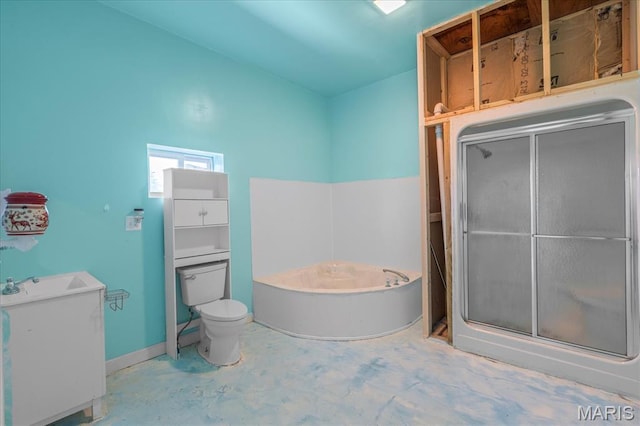 full bath featuring a stall shower, a garden tub, toilet, concrete flooring, and a sink