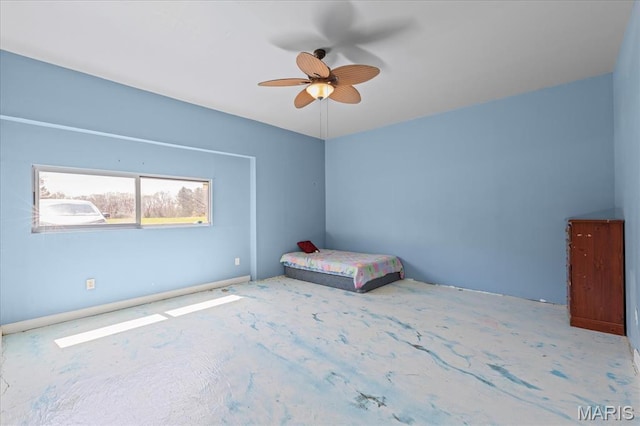 unfurnished bedroom featuring ceiling fan