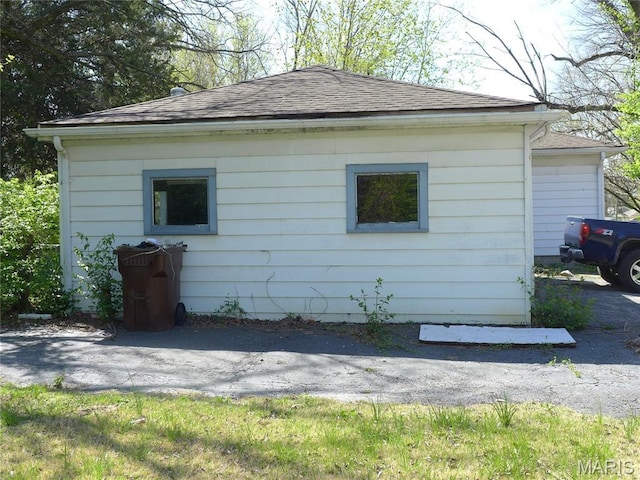 340 Wedge Dr, Saint Louis, MO 63135 - view of side of home with a shingled roof