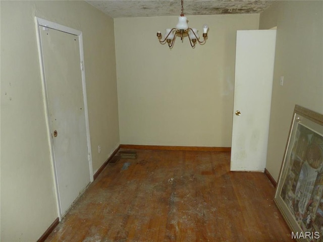 340 Wedge Dr, Saint Louis, MO 63135 - unfurnished dining area featuring a chandelier and baseboards