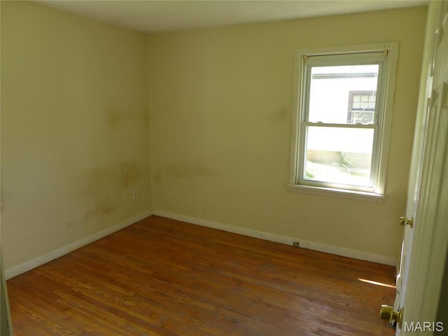 340 Wedge Dr, Saint Louis, MO 63135 - spare room featuring wood finished floors, healthy amount of natural light, and baseboards