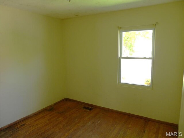 340 Wedge Dr, Saint Louis, MO 63135 - unfurnished room featuring wood finished floors and baseboards