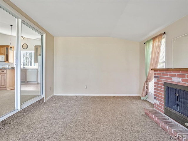 4522 Meadow Ln, Red Bud, IL 62278 - unfurnished living room featuring carpet flooring, vaulted ceiling, a brick fireplace, and baseboards