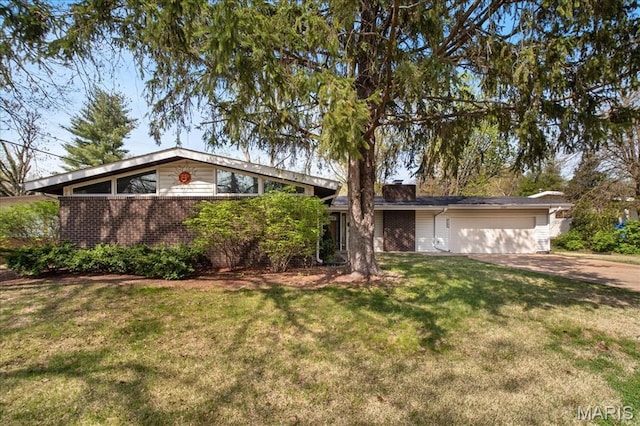 3105 Newgate Dr, Florissant, MO 63033 - mid-century home with an attached garage, brick siding, concrete driveway, and a front yard