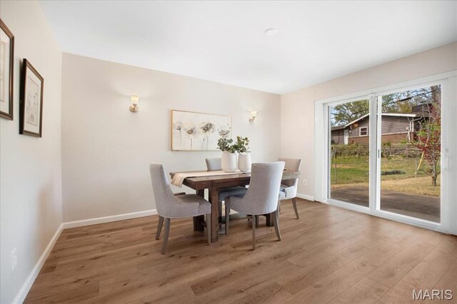 3105 Newgate Dr, Florissant, MO 63033 - dining space featuring light wood-style flooring and baseboards