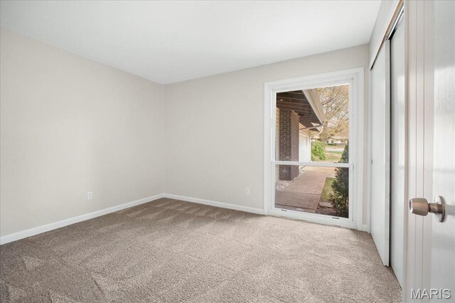 3105 Newgate Dr, Florissant, MO 63033 - carpeted empty room featuring baseboards
