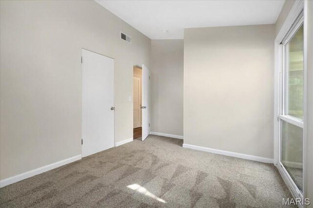 3105 Newgate Dr, Florissant, MO 63033 - spare room featuring carpet and baseboards