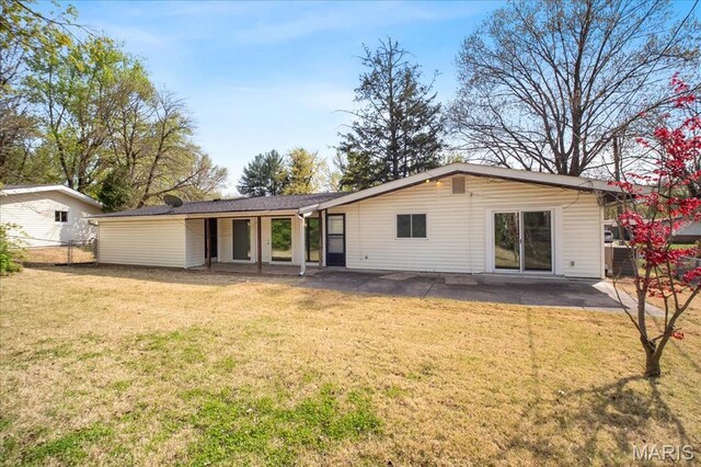 3105 Newgate Dr, Florissant, MO 63033 - back of house featuring a patio area